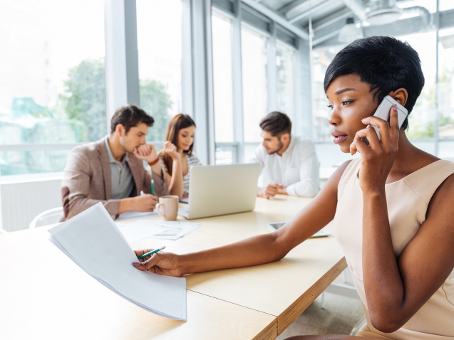 serious-businesswoman-with-documents-talking-on-P9Q6LX6t5t33-min
